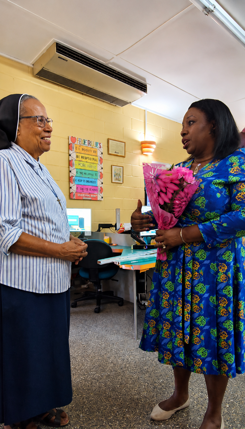 MyCashlessClass Founder Dawn Nelson presents flowers to the session''s host Sister Ivy Pacheco, Principal of St. Xavier''s Private School