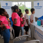 MyCashlessClass Founder Dawn Nelson leads a digital-literacy session with young entrepreneurs at Kidpreneur Island, 2025